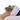 A woman lying down with the I MASK purifying probiotic mask applied to her face on a clean white background.