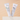 Two tubes of ORMEDIC lip enhancement complex standing upright on a white platform against a warm beige background. One tube is labeled 'ORMEDIC balancing lip enhancement complex', and the other is labeled 'ORMEDIC sheer pink lip enhancement complex'.